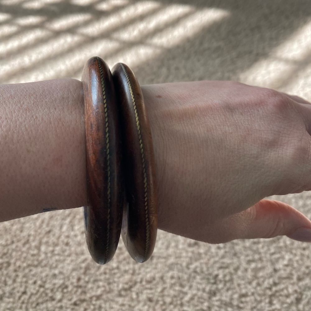 2 wooden bracelets with antique gold detail